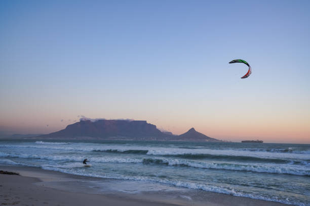 istock Kite surfing in Atlantic ocean with table mountain in the background Cape Town 1255461610