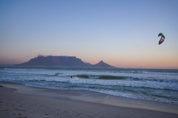 istock Kite surfing in Atlantic ocean with table mountain in the background Cape Town 1255461622