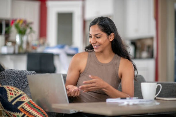 istock Young woman working from home 1255462641