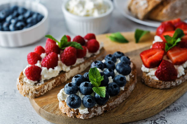 istock Fresh breakfast with Blueberry, Strawberry and raspberry ricotta rye sandwiches 1255462794