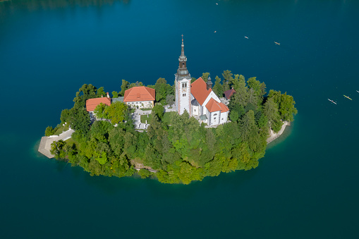 Aerial Panorama of the beautiful Church on the Island of Lake Bled, Slovenia. The famous island with the Pilgrimage Church of the Assumption of Maria. Cerkev Marijinega Vnebovzetja. Converted from RAW.