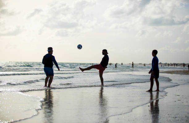 istock Playing soccer on the beach in Florida 1255463132