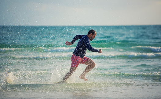 Running fast on the beach in Sarasota Florida