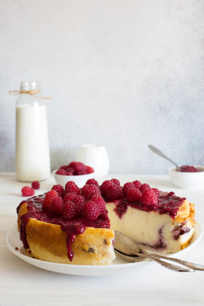 istock Homemade baked ricotta cheese cake with raspberries 1255463798