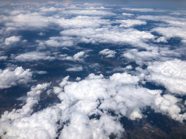 istock aerial view of ground above clouds 1255466507