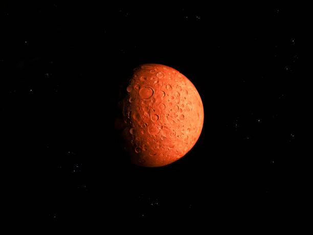 istock Red planet with many craters in space with stars 1255467308