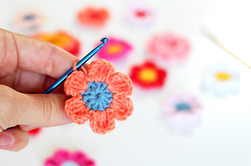 This colored floral motif is crocheted of pink and orange flowers.