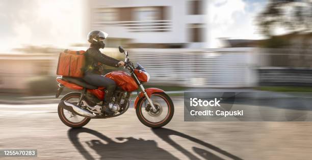 Biker In Motion Motogirl Motoboy Stock Photo - Download Image Now - Motorcycle, Delivering, Motorcycle Courier