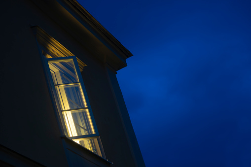 Open window at night with deep blue sky