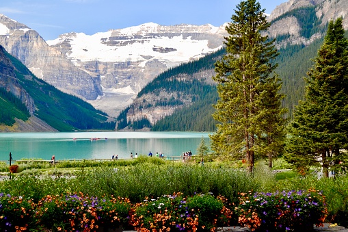 View of the Rocky Mountains and the beautiful blue Lake Louise in Alberta Canada
