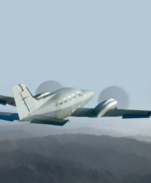 istock Vintage propeller aircraft on bright blue sky 1255479750