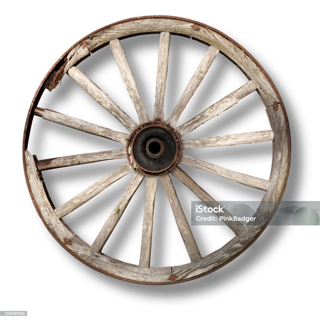 vintage wagon wheel casting shadow worn wooden vintage wagon wheel casting shadow on white background Wagon Wheel Stock Photo
