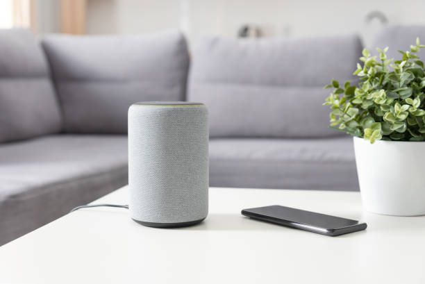 istock Smart speaker device in living room. Smart home. 1255481055