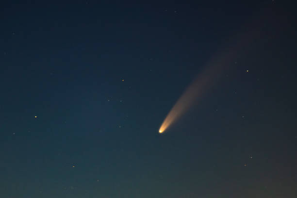 istock Comet Neowise in the dark night sky 1255481201