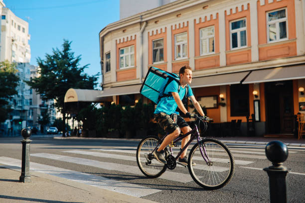 istock Food delivery man on the bicycle 1255486573