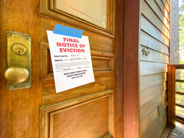 istock Eviction notice on door of house 1255486783