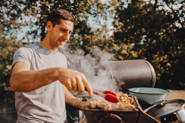 istock A man ready to grill in the yard 1255487633