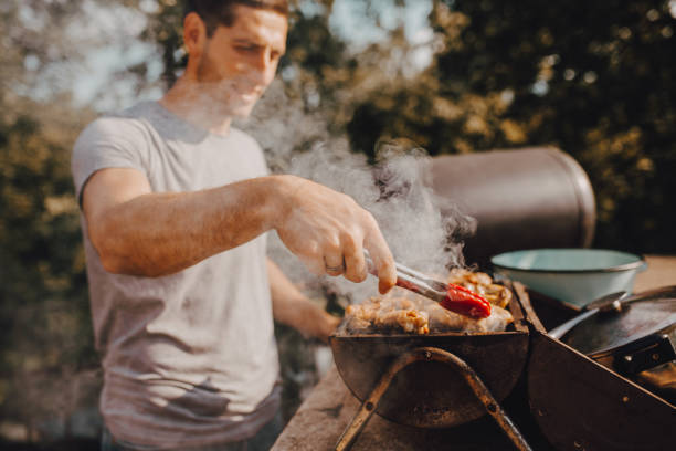 A man ready to grill in the yard