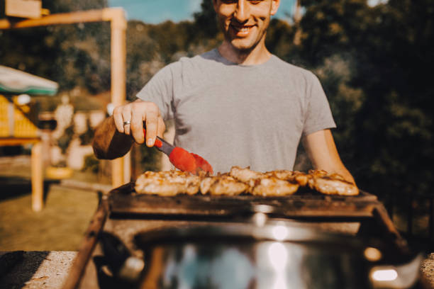 istock A man ready to grill in the yard 1255489827