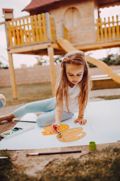 istock A little girl enjoys drawing 1255490610