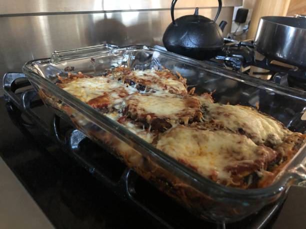 istock Making eggplant parmesan at home 1255495888