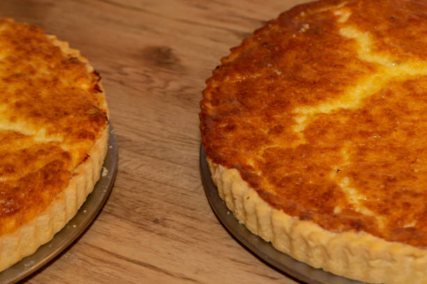 istock delicious cheese quiches on wooden background. 1255501044