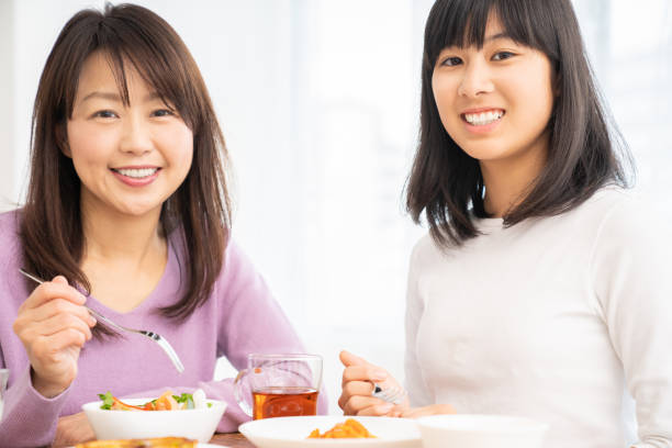 istock asian parent and daughter 1255503580