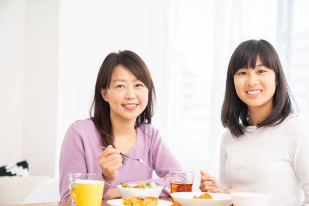 istock asian parent and daughter 1255503673