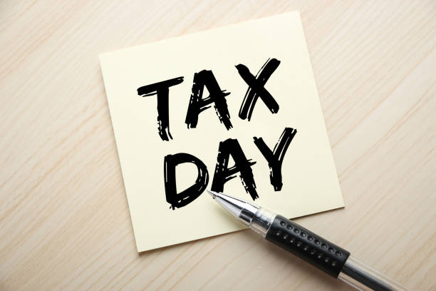 istock Tax Day Concept On Sticky Note 1255508214
