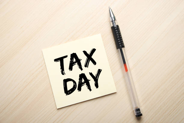 istock Tax Day Concept On Sticky Note 1255508223