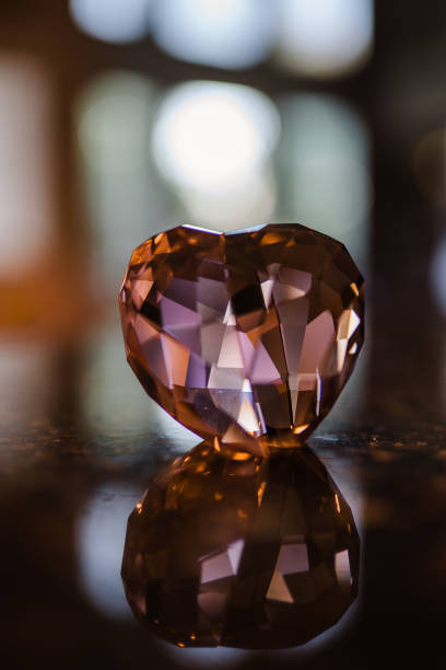 istock Crystal heart shining in the dark 1255513046
