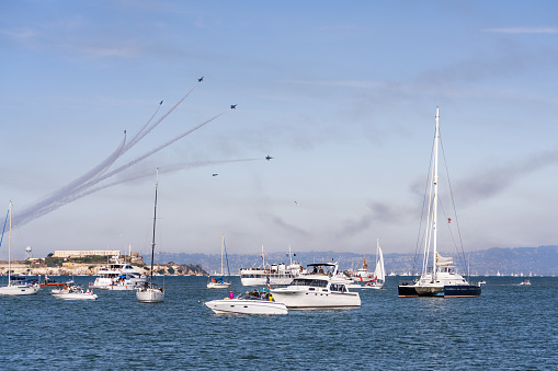 Oct 12, 2019 San Francisco / CA / USA - Visitors watching the Fleet Week airshow from the shoreline and from ships sailing in San Francisco Bay