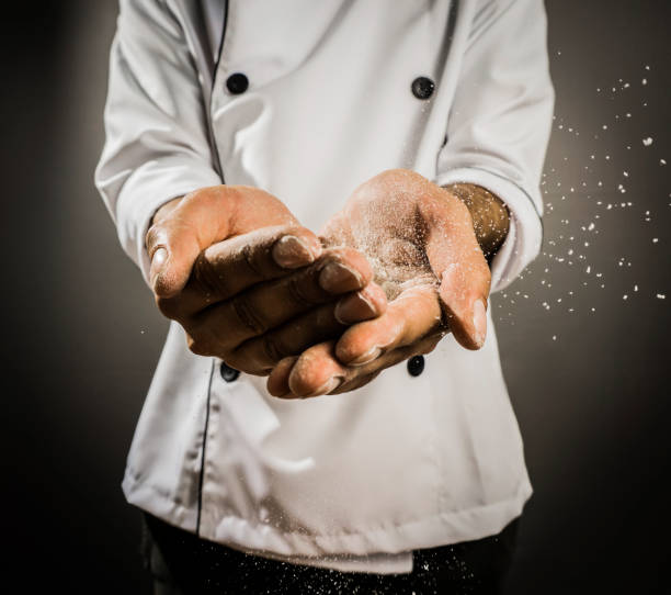 Close up of unrecognizable male chef with flour on hands