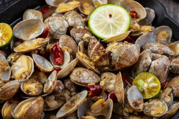 istock Boiled clams with chili in an iron pot 1255516455