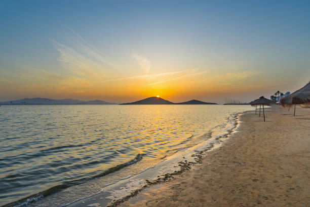 Sunset on the beach by the sea. La Manga del Mar Menor. Murcia, Spain Sunset on the beach by the sea. La Manga del Mar Menor. Murcia, Spain cartagena spain stock pictures, royalty-free photos & images