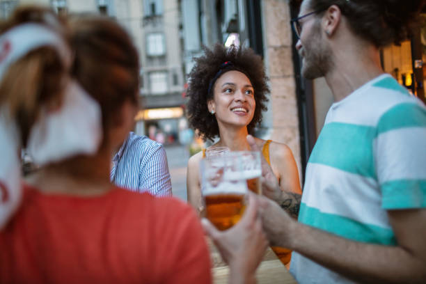 istock Friends in Pub drinking Beer  and having Fun 1255521274