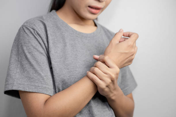 istock Woman suffering from pain in wrist. 1255521310