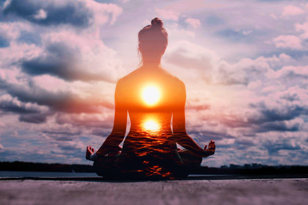 yoga day concept. multiple exposure image. woman practicing lotus asana at sunset. - spiritual practices imagens e fotografias de stock