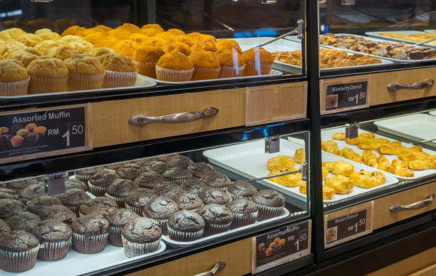 istock Assorted muffins and pastry arranged on tray at bakery shop. 1255523282