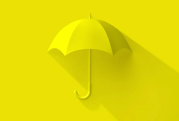 istock Yellow umbrella with shadow on yellow background 1255524787