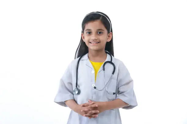Nurture their interests- Child dressed as doctor