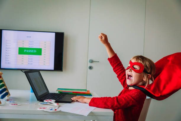 istock happy kid passed exam online, remote learning success concept 1255528671
