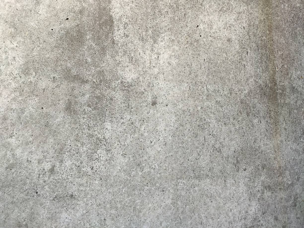 istock Grey Concrete Texture old wall with peeling paint, scratches and cracks 1255533174