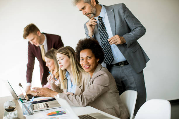 istock Group of young multiethnic business people working on new project 1255535073