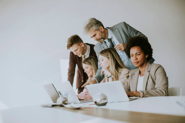 istock Group of young multiethnic business people working on new project 1255535077