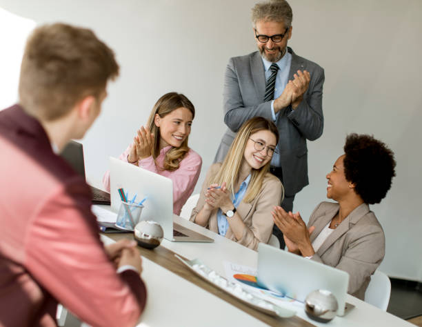 istock Group of multiethnic business people hear great news while working on new project 1255535078