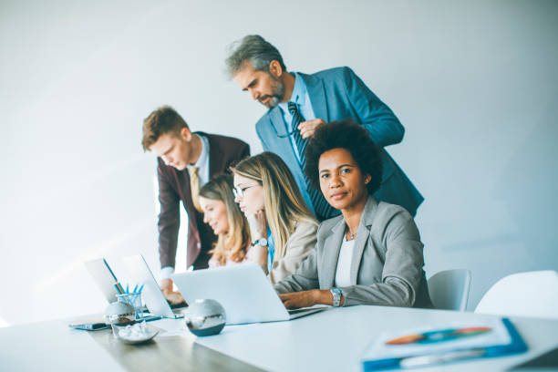 istock Group of young multiethnic business people working on new project 1255535079