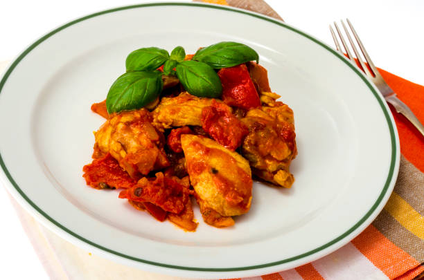 istock Chicken breast fillet braised with vegetables, paprika. 1255540265
