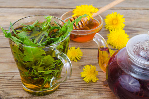 istock Cup of tea from fresh dandelion leaves. 1255541625