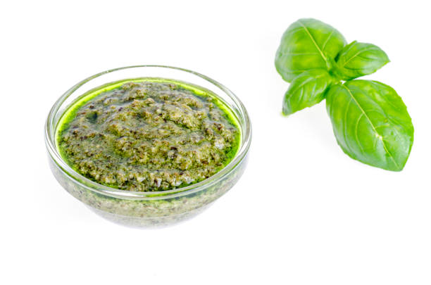 istock Pesto sauce and fresh green basil leaves. 1255542282